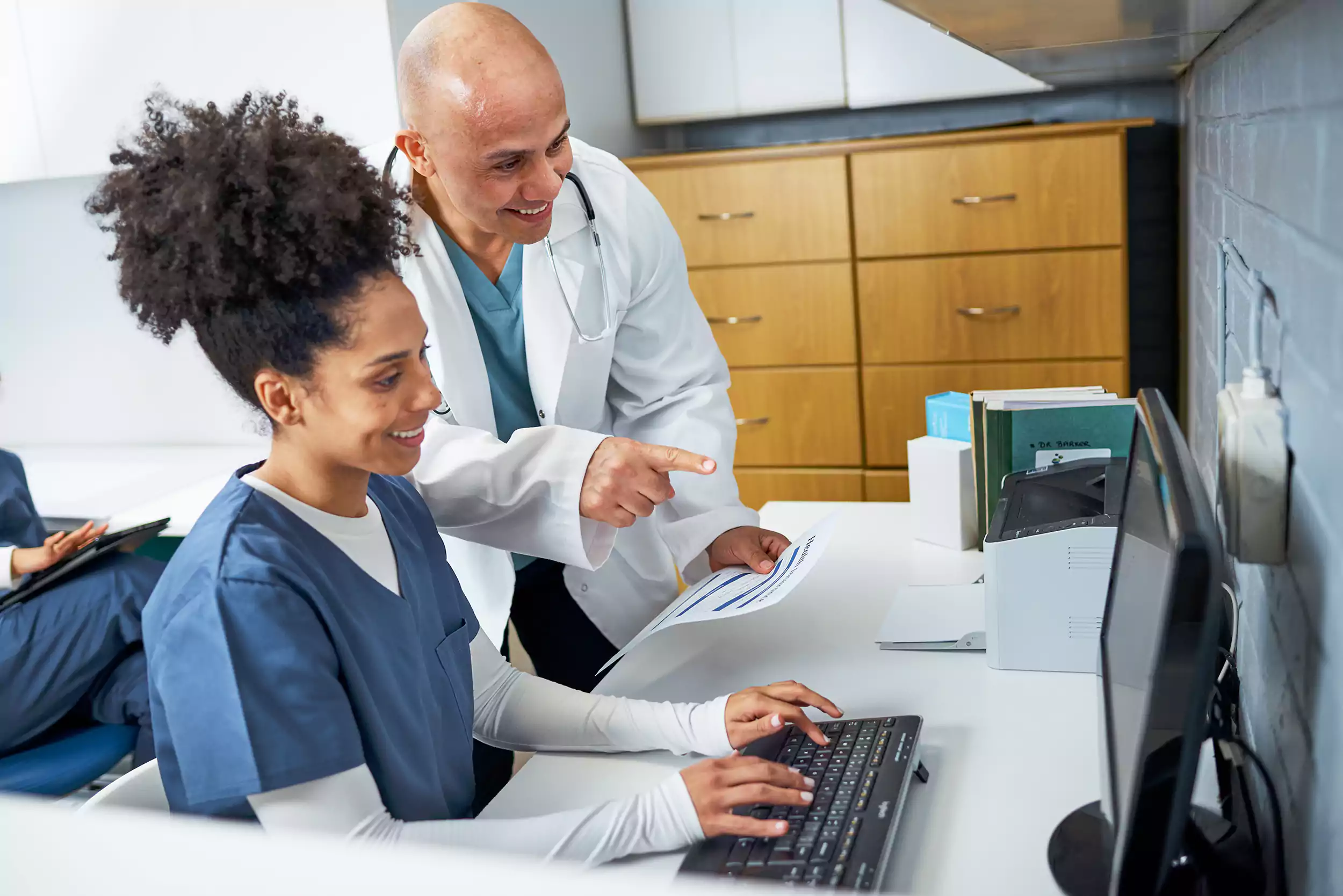 Doctor Teaching the nurse about the Medical Match Applications