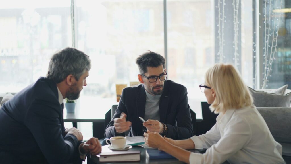 Leaders meeting around a table