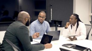 Leadership team meeting with laptops