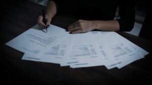 Woman reviewing paperwork at a table