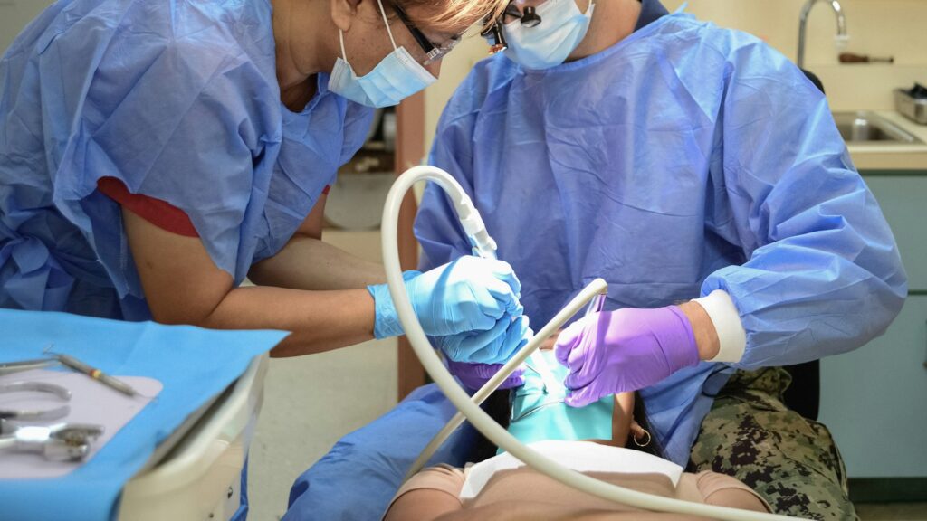 Clinicians working with a patient in a clinic