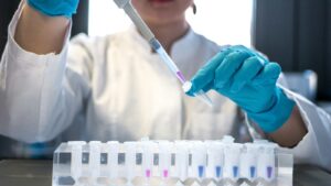 Lab technician using a pipette