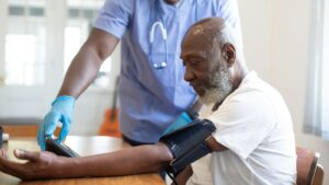 Doctor checking a patient's blood pressure