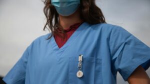 Healthcare worker wearing protective goggles
