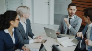 Four professionals in a meeting