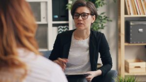 Two women talking in a counseling setting